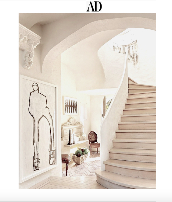 Christopher Flach's large-scale figure drawing anchoring the plaster stair hall of a Long Island home in Architectural Digest, April 2019